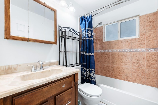 full bathroom featuring vanity, toilet, and shower / bath combo with shower curtain