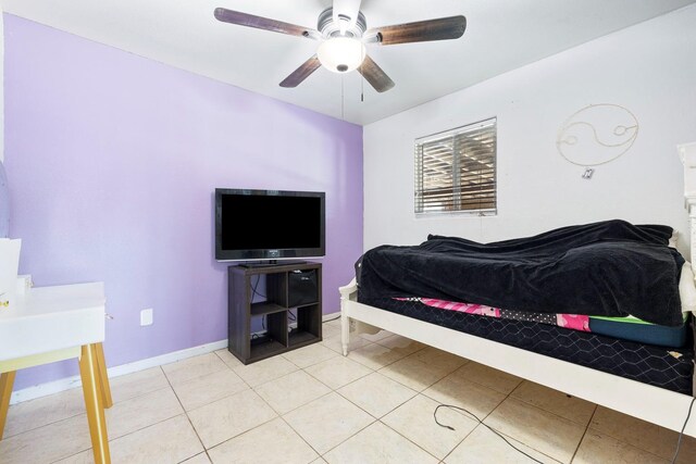 tiled bedroom with ceiling fan