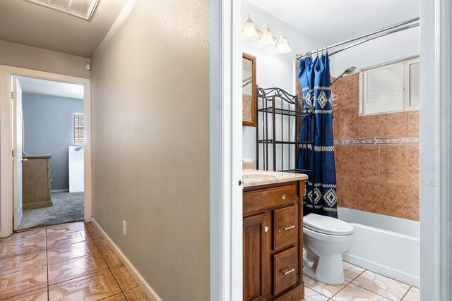 full bathroom with shower / bath combo, vanity, and toilet