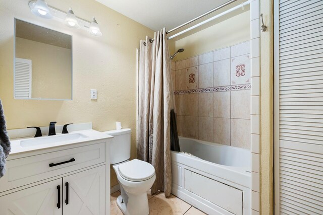 full bathroom featuring tile patterned floors, vanity, toilet, and shower / bathtub combination with curtain