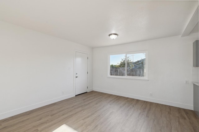 unfurnished room with light hardwood / wood-style flooring