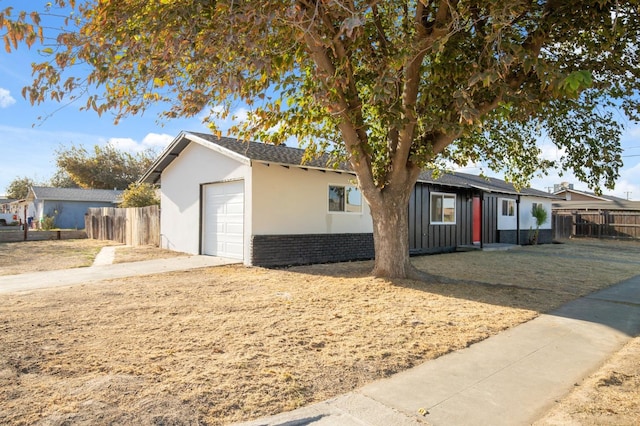 ranch-style house featuring a garage