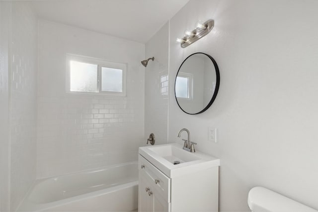 full bathroom featuring vanity, toilet, and tiled shower / bath combo