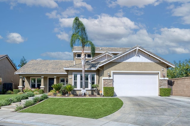 craftsman house with a garage and a front yard