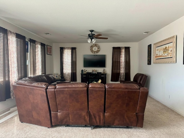 living room featuring ceiling fan and light carpet