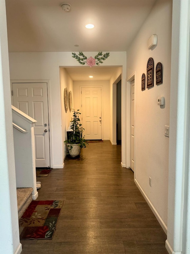 hall with dark hardwood / wood-style floors