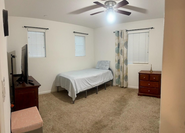 bedroom featuring ceiling fan and light colored carpet