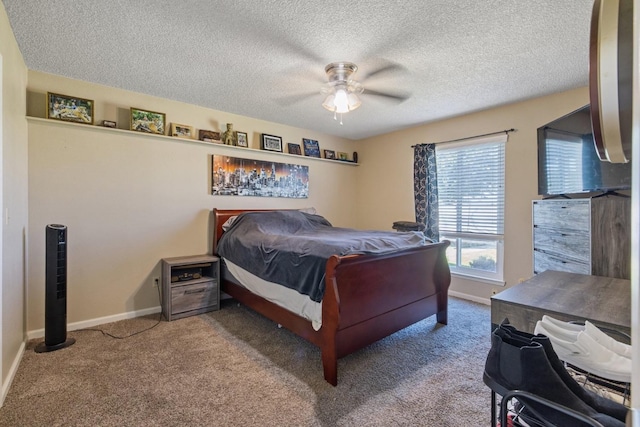 carpeted bedroom featuring a textured ceiling and ceiling fan