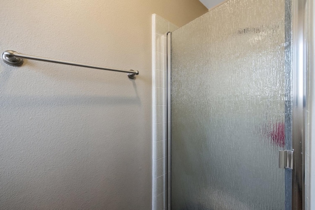 bathroom featuring an enclosed shower