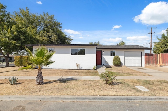 ranch-style home featuring a garage