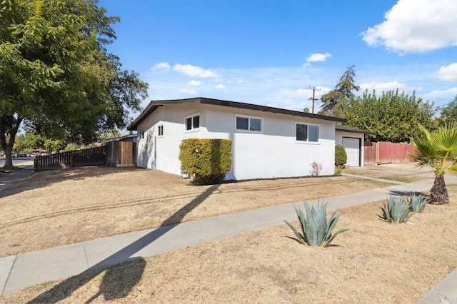 single story home featuring a garage