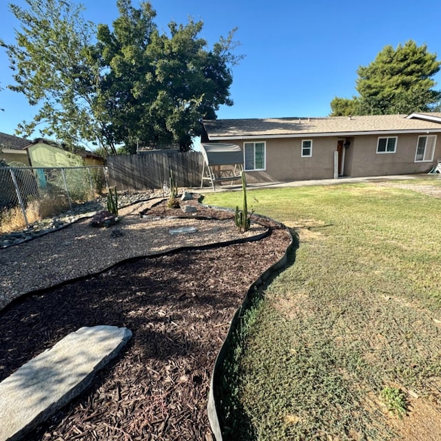 exterior space with a patio and a fenced backyard