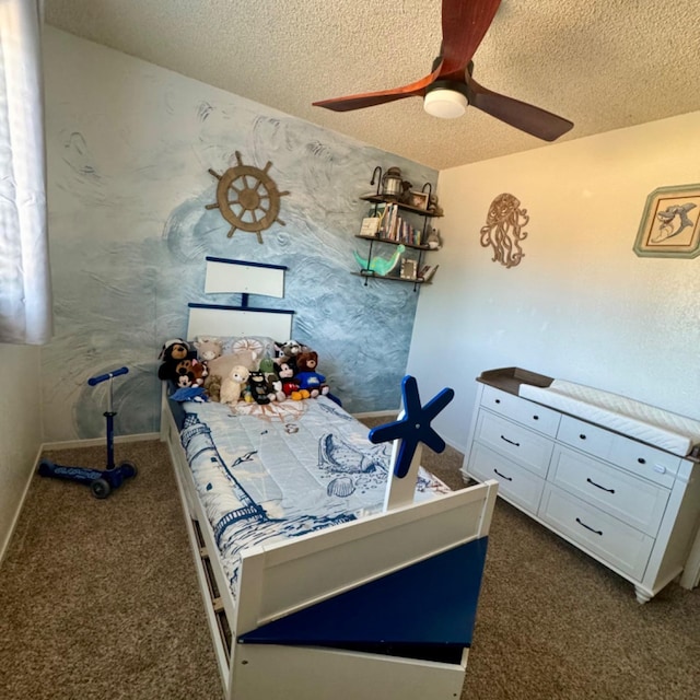 carpeted bedroom featuring a ceiling fan, a textured ceiling, and baseboards