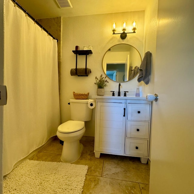 full bathroom featuring toilet, tile patterned flooring, vanity, and visible vents