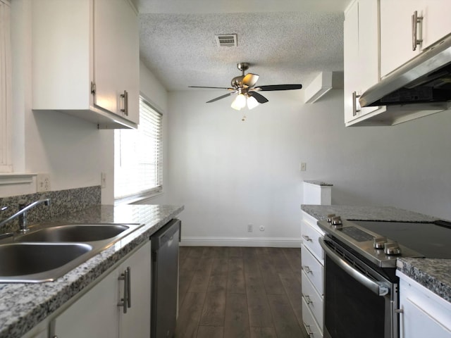 kitchen featuring ceiling fan, white cabinets, sink, stainless steel appliances, and dark hardwood / wood-style floors