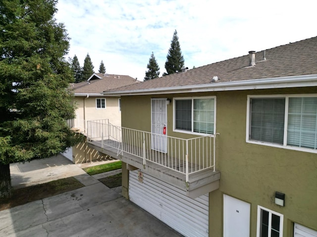 view of side of property with a patio area