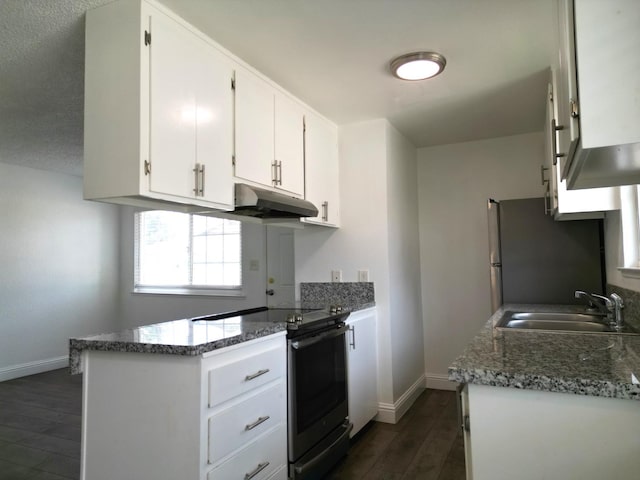 kitchen featuring white cabinets, appliances with stainless steel finishes, dark hardwood / wood-style floors, and sink