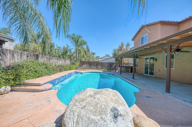 view of pool featuring a patio and ceiling fan