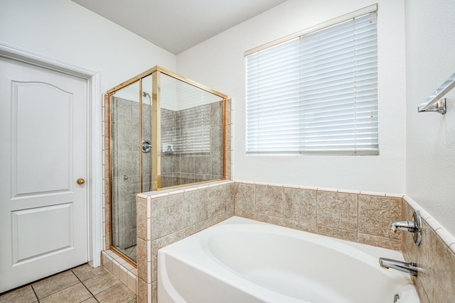 bathroom with tile patterned flooring, plenty of natural light, and plus walk in shower