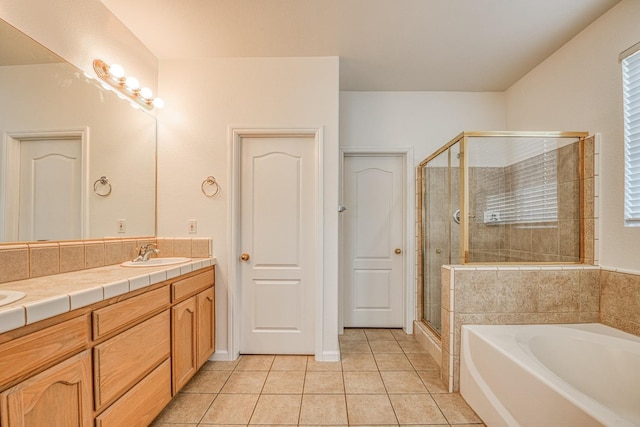 bathroom with vanity, separate shower and tub, and tile patterned flooring