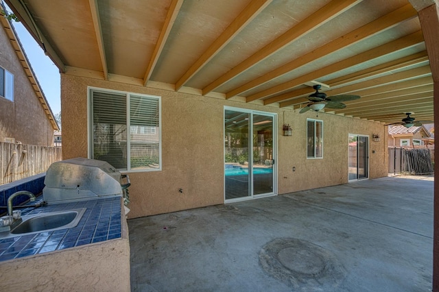 view of patio / terrace with sink and ceiling fan