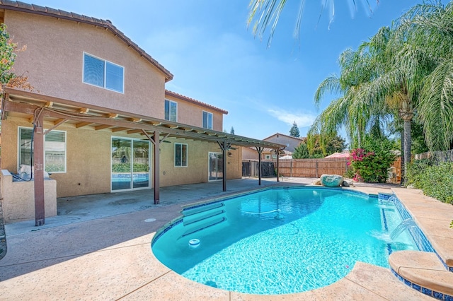 view of pool with a patio area and pool water feature