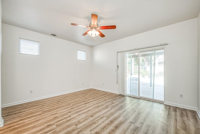 unfurnished room with ceiling fan and light wood-type flooring