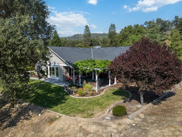 exterior space featuring a lawn and a patio