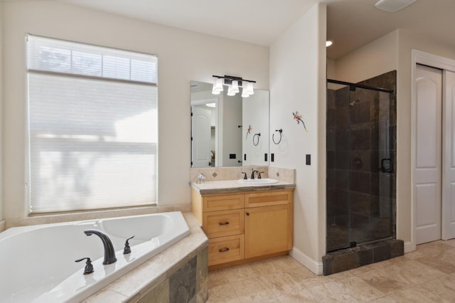 bathroom with tile patterned floors, vanity, and separate shower and tub