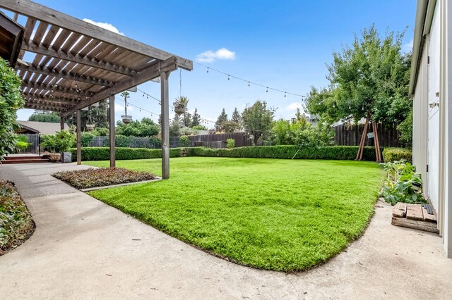 view of yard with a pergola and a patio