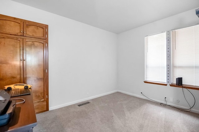 office space with light colored carpet