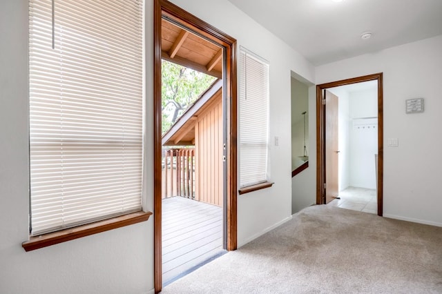 hallway with light carpet