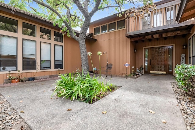 back of property featuring a patio area