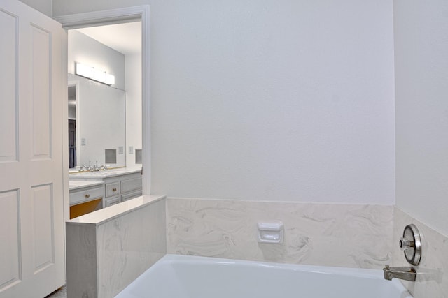 bathroom featuring vanity and a bathtub