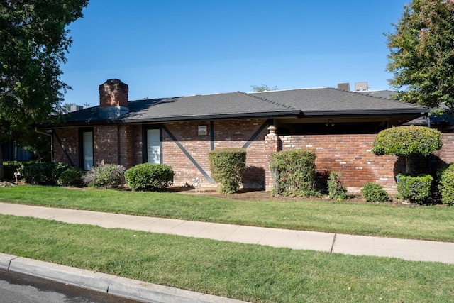 ranch-style home featuring a front yard