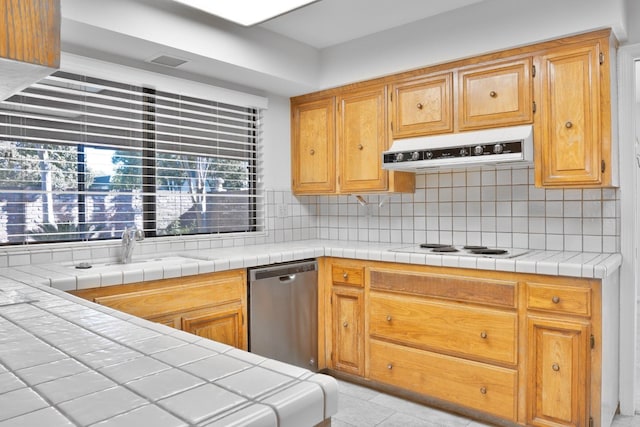 kitchen featuring light tile patterned flooring, tasteful backsplash, white electric stovetop, tile countertops, and stainless steel dishwasher