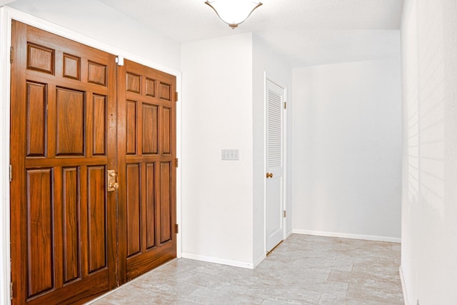 entryway featuring a textured ceiling