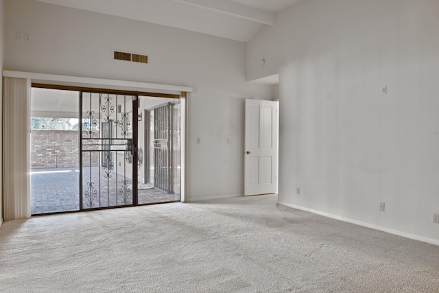 unfurnished room with high vaulted ceiling, beam ceiling, and light colored carpet