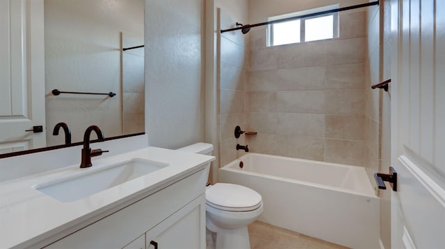 full bathroom featuring vanity, toilet, and tiled shower / bath