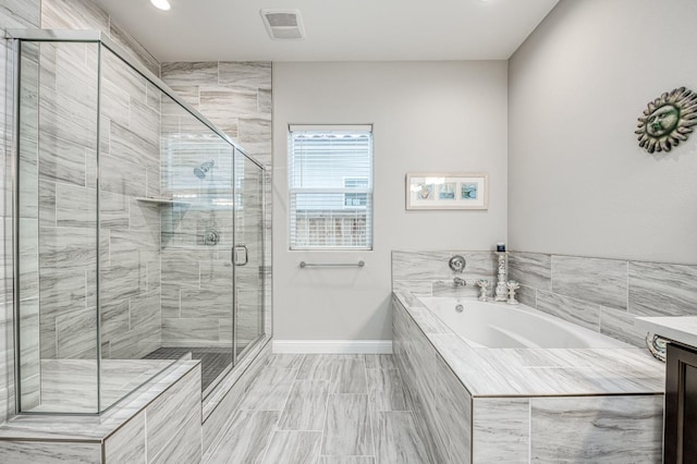 bathroom featuring vanity and plus walk in shower