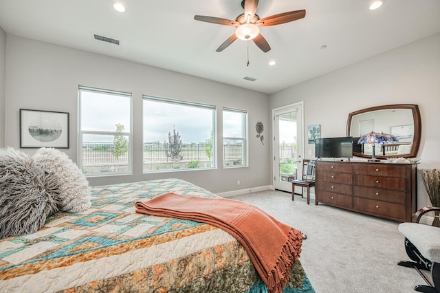 bedroom with light colored carpet and ceiling fan