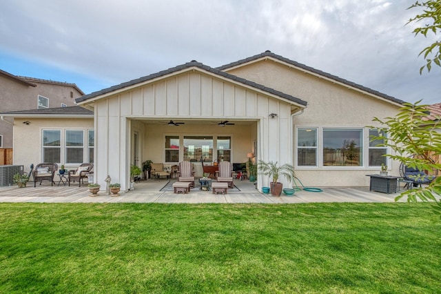 back of house with a patio area, a yard, and ceiling fan