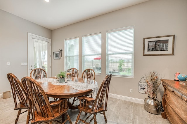 dining space featuring light wood-type flooring