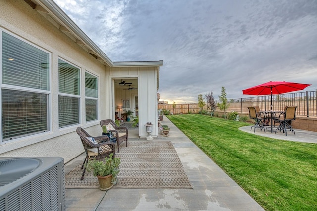 view of patio featuring central air condition unit and ceiling fan