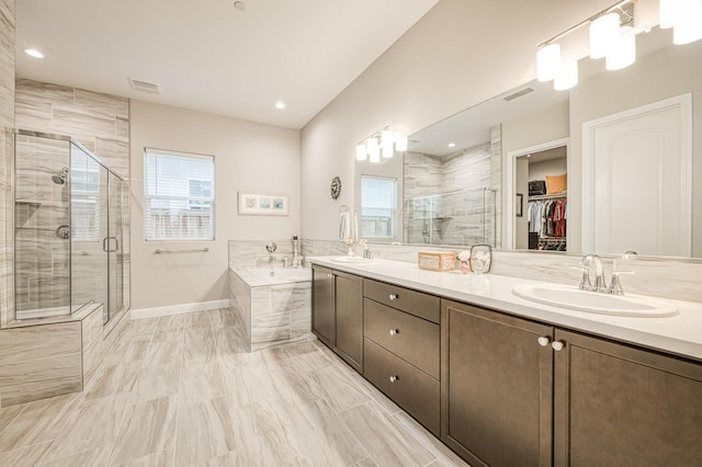 bathroom with vanity and plus walk in shower