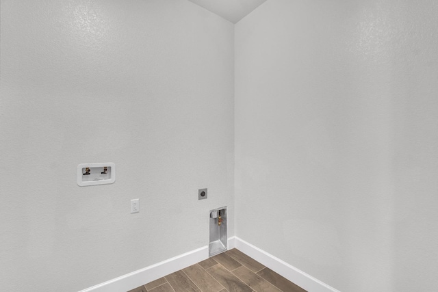 laundry area featuring washer hookup, dark hardwood / wood-style floors, and electric dryer hookup