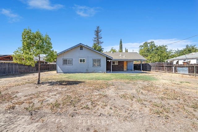 rear view of property featuring a patio