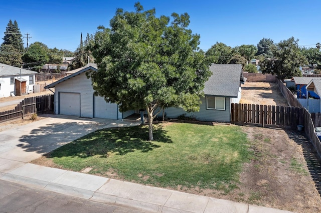 view of front facade featuring a garage and a front lawn