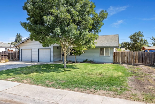 view of front of house with a front lawn and a garage