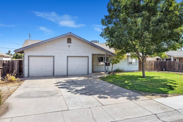 single story home featuring a garage and a front lawn